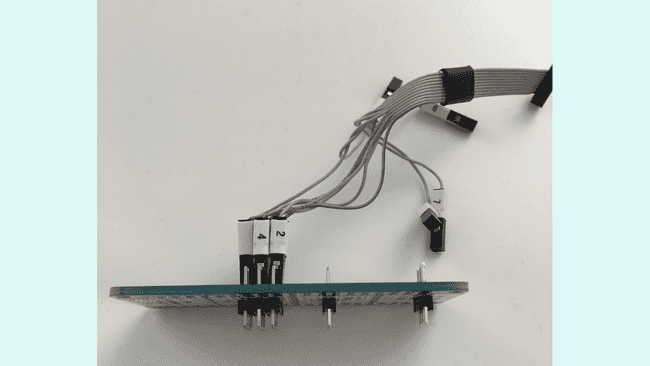 A MKR Proto Shield and 6 2.54mm straight male headers used to access the exposed pads of the board.